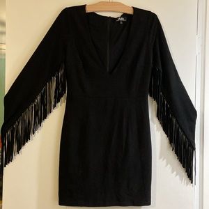 Lulu’s black plunging neck, fringe long sleeve mid dress